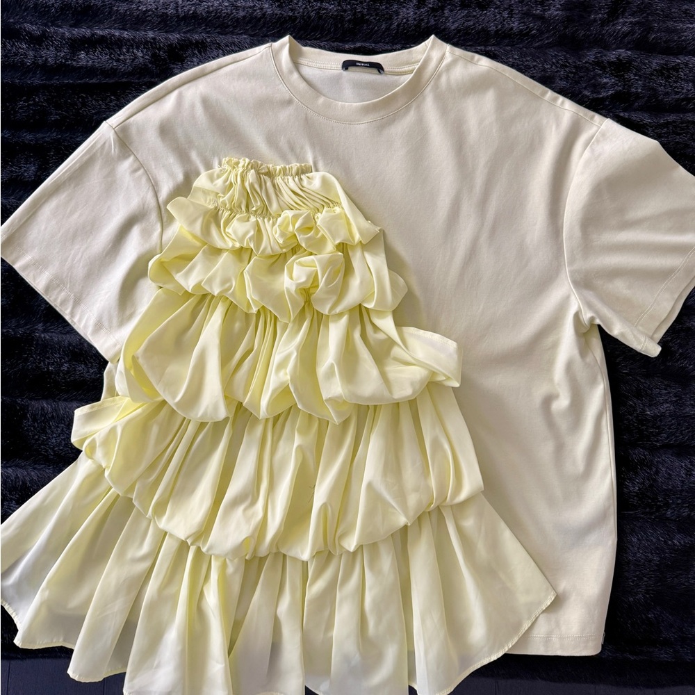 INITIAL light yellow Tee with cascading ruffle.